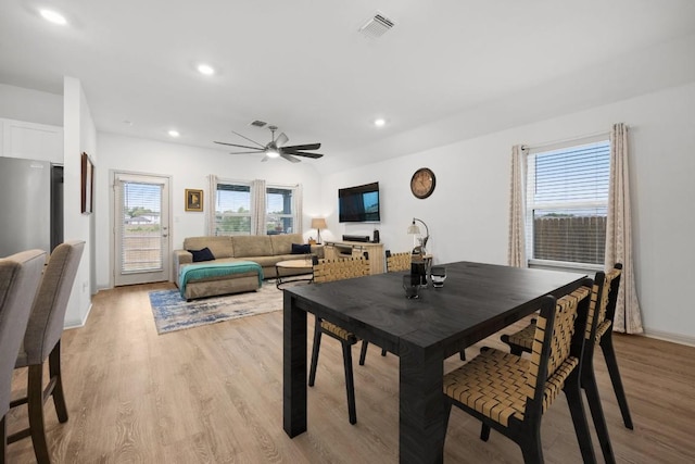 dining room with light wood-type flooring, recessed lighting, a ceiling fan, and baseboards