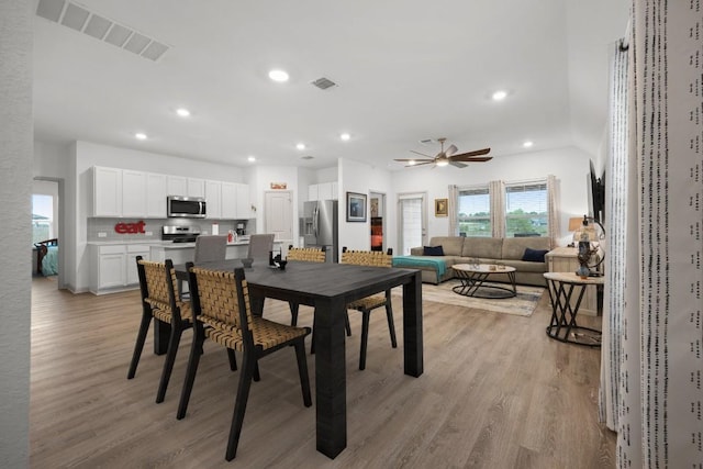 110 Johnson Draw Rd, Hutto, TX 78634 - dining space with light wood-style flooring, a ceiling fan, and recessed lighting