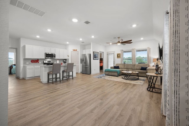 110 Johnson Draw Rd, Hutto, TX 78634 - living area featuring ceiling fan, light wood finished floors, and recessed lighting