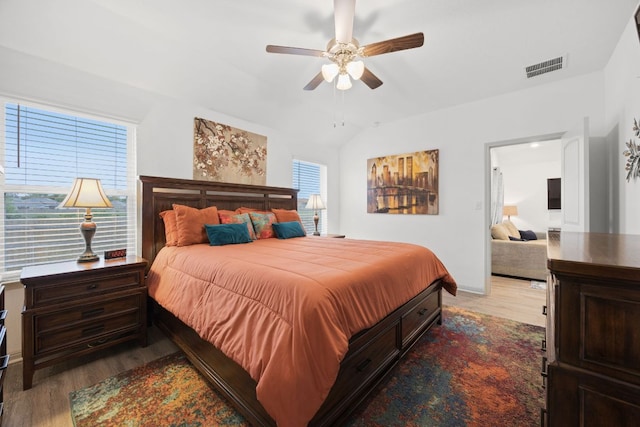110 Johnson Draw Rd, Hutto, TX 78634 - bedroom with wood finished floors, lofted ceiling, and ceiling fan