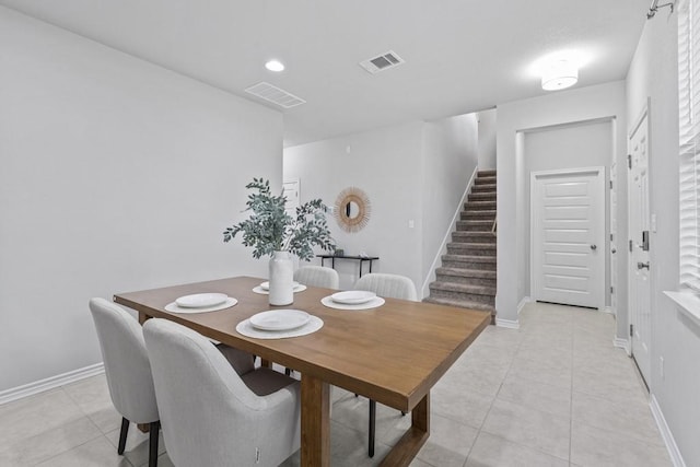 1808 Pecan Island Dr, Leander, TX 78641 - dining area with stairs, light tile patterned floors, and baseboards
