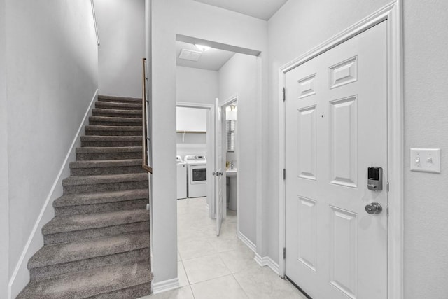 1808 Pecan Island Dr, Leander, TX 78641 - stairs featuring washer and clothes dryer, tile patterned floors, and baseboards