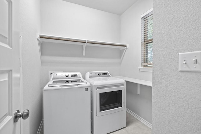 1808 Pecan Island Dr, Leander, TX 78641 - laundry area featuring washer and clothes dryer and tile patterned flooring