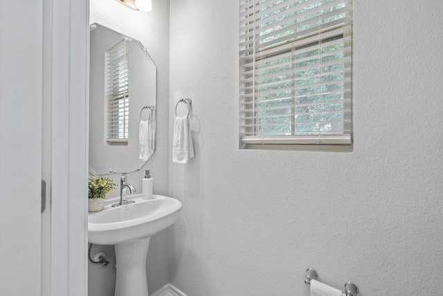 1808 Pecan Island Dr, Leander, TX 78641 - bathroom with a textured wall and a sink