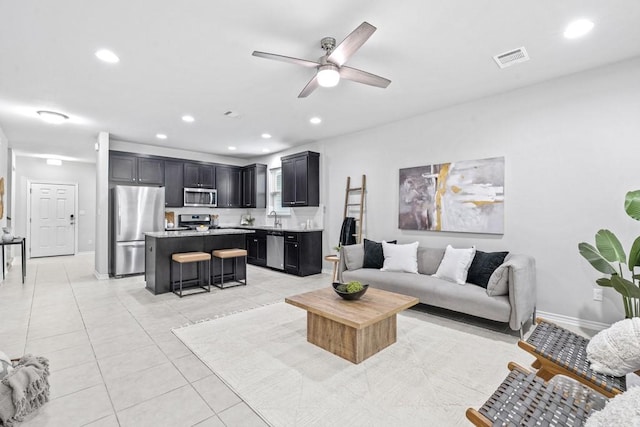 1808 Pecan Island Dr, Leander, TX 78641 - living room with a ceiling fan, recessed lighting, light tile patterned floors, and baseboards