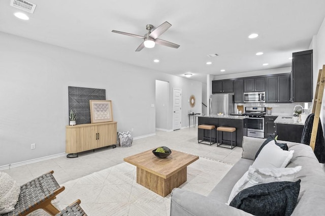 1808 Pecan Island Dr, Leander, TX 78641 - living area with recessed lighting, a ceiling fan, light tile patterned flooring, and baseboards