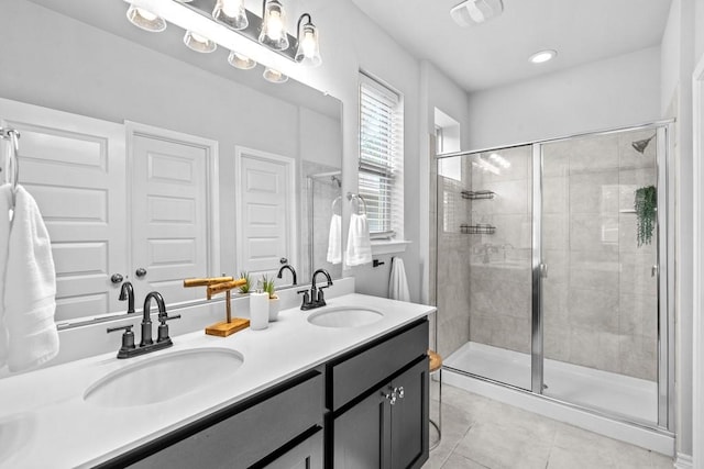 1808 Pecan Island Dr, Leander, TX 78641 - bathroom featuring tile patterned flooring, a shower stall, and double vanity