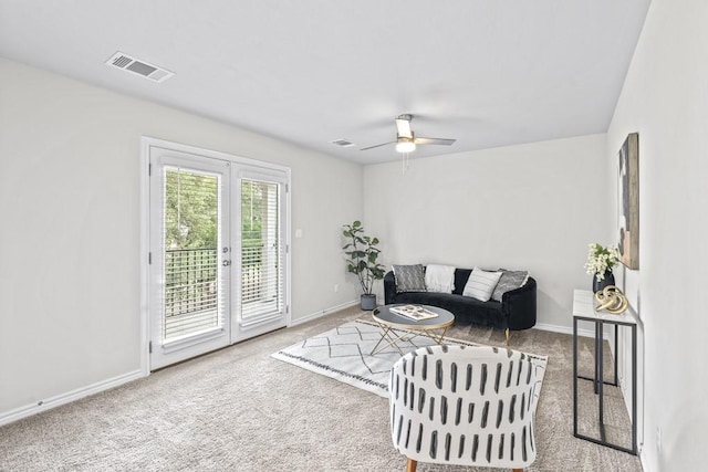 1808 Pecan Island Dr, Leander, TX 78641 - carpeted living area with french doors, ceiling fan, and baseboards