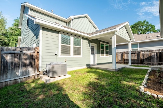 1808 Pecan Island Dr, Leander, TX 78641 - back of property with central AC unit and a patio area