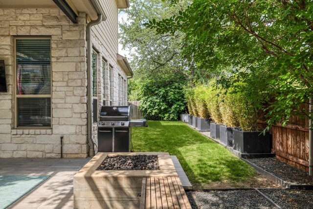 view of yard with a fire pit