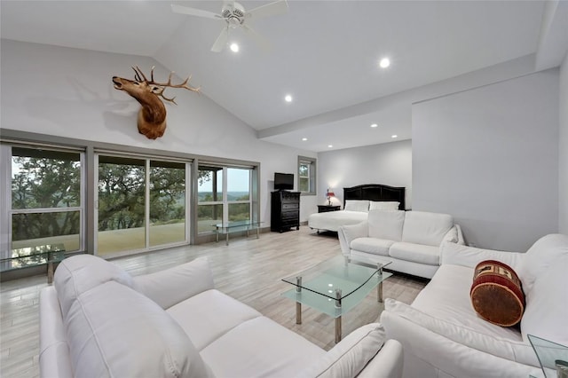 1785 Backbone Rdg, Wimberley, TX 78666 - living room featuring high vaulted ceiling, recessed lighting, wood finished floors, and ceiling fan