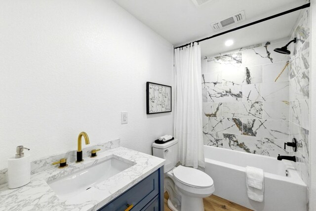 337 Forest Lake Dr, Del Valle, TX 78617 - bathroom with shower / tub combo with curtain, vanity, and wood finished floors