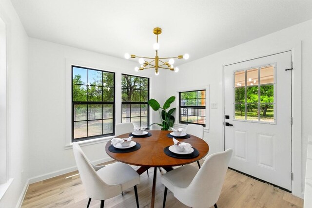 337 Forest Lake Dr, Del Valle, TX 78617 - dining space featuring a chandelier and light wood-type flooring