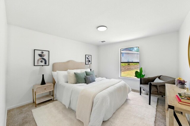 337 Forest Lake Dr, Del Valle, TX 78617 - bedroom featuring light colored carpet and baseboards