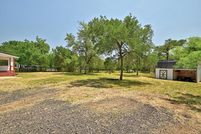 337 Forest Lake Dr, Del Valle, TX 78617 - view of green lawn with a shed