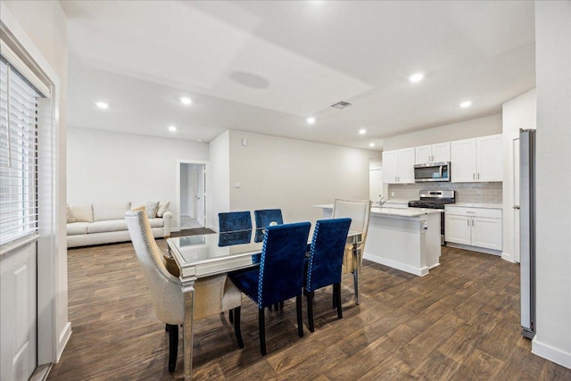 625 Jane Long Dr, San Marcos, TX 78666 - dining area with dark wood finished floors and recessed lighting