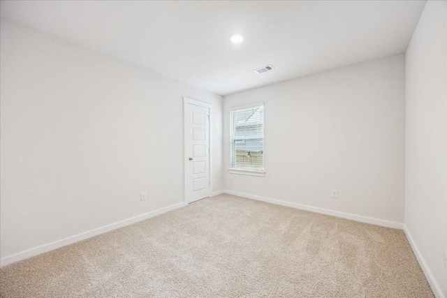 625 Jane Long Dr, San Marcos, TX 78666 - spare room featuring light colored carpet, baseboards, and recessed lighting