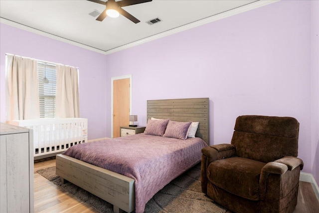 2604 Saratoga Dr, Austin, TX 78733 - bedroom featuring crown molding, wood finished floors, and a ceiling fan