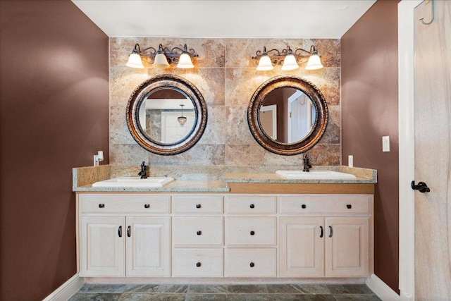 2604 Saratoga Dr, Austin, TX 78733 - bathroom with baseboards and double vanity