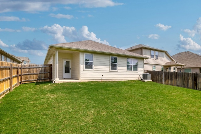 rear view of house featuring central air condition unit and a patio area