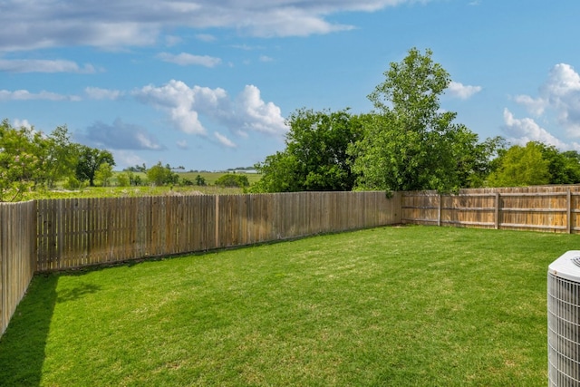 view of yard with central AC unit