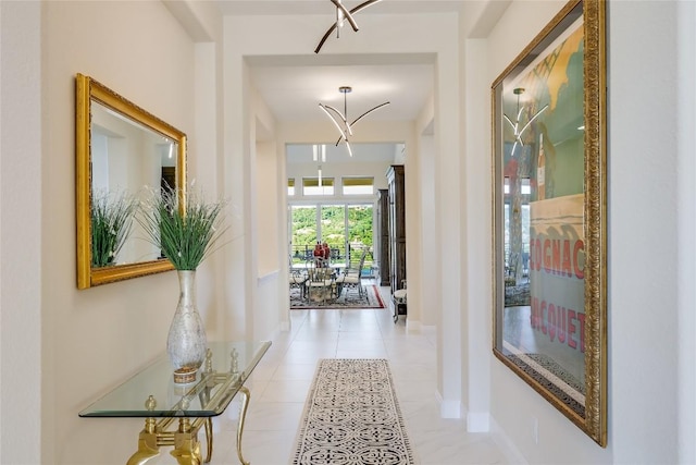 2212 Normandy Vw, Leander, TX 78641 - corridor with baseboards, a chandelier, and tile patterned flooring