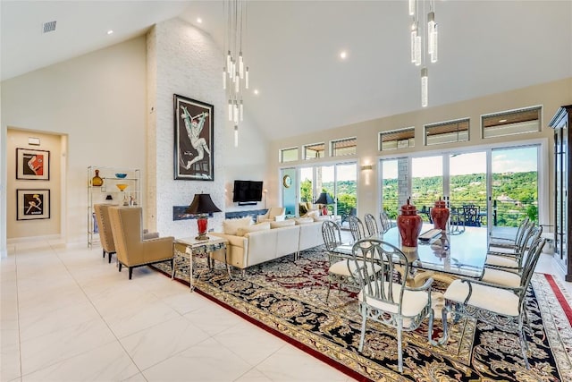 2212 Normandy Vw, Leander, TX 78641 - living room with high vaulted ceiling, baseboards, and light tile patterned floors