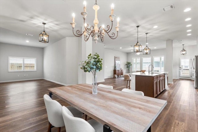 7909 Catbird Ln, Austin, TX 78744 - dining area featuring plenty of natural light, recessed lighting, and dark wood-style flooring