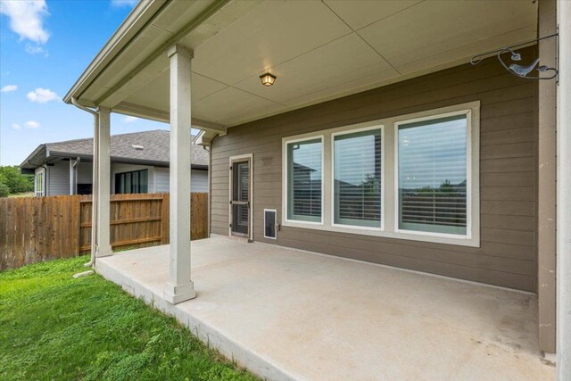view of patio / terrace featuring fence