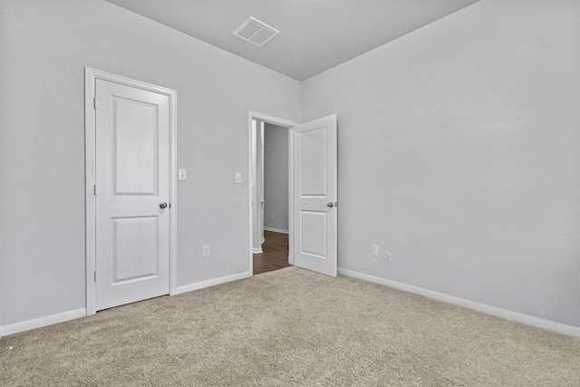 518 Algaroba Loop, Buda, TX 78610 - unfurnished bedroom with carpet flooring and baseboards