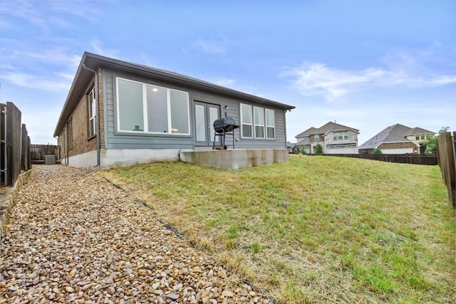 518 Algaroba Loop, Buda, TX 78610 - back of house with cooling unit