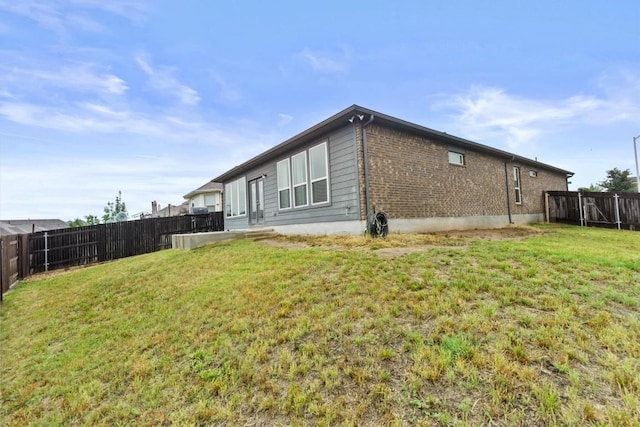 518 Algaroba Loop, Buda, TX 78610 - back of house with brick siding