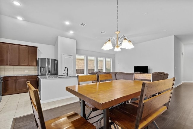 518 Algaroba Loop, Buda, TX 78610 - dining room with a chandelier, recessed lighting, and light wood-style flooring