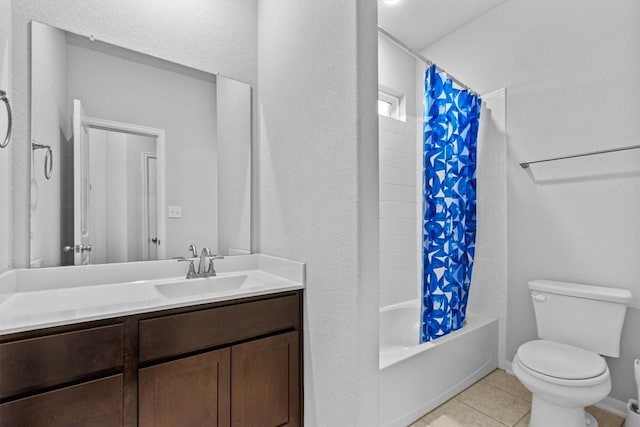 518 Algaroba Loop, Buda, TX 78610 - full bathroom with tile patterned floors, vanity, toilet, and shower / bath combo with shower curtain