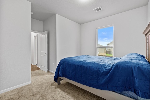 518 Algaroba Loop, Buda, TX 78610 - bedroom with carpet floors and baseboards