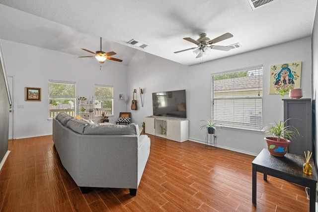 1320 Anna Palm Way, Round Rock, TX 78665 - living area with a ceiling fan, wood finished floors, and lofted ceiling