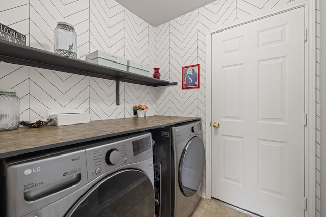 1320 Anna Palm Way, Round Rock, TX 78665 - laundry room with washer and clothes dryer and wallpapered walls
