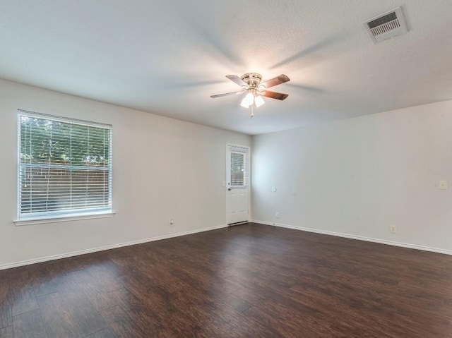 131 Ames Cv, Kyle, TX 78640 - empty room featuring a ceiling fan and dark wood-style floors
