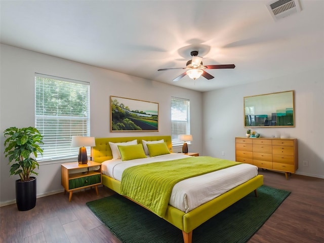 131 Ames Cv, Kyle, TX 78640 - bedroom with wood finished floors, baseboards, and ceiling fan