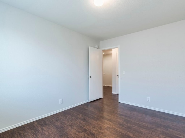 131 Ames Cv, Kyle, TX 78640 - empty room with dark wood-type flooring and baseboards