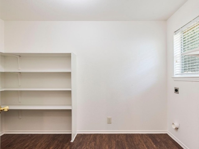 131 Ames Cv, Kyle, TX 78640 - unfurnished room with dark wood finished floors and baseboards