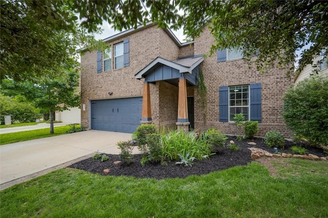 205 Talon Grasp Trl, Leander, TX 78641 - traditional home with brick siding, concrete driveway, an attached garage, and a front lawn