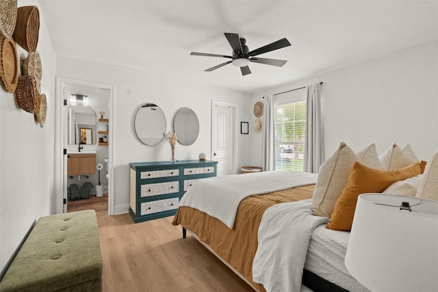 2812 Sissinghurst Dr, Austin, TX 78745 - bedroom featuring light wood-type flooring, ceiling fan, ensuite bathroom, and baseboards