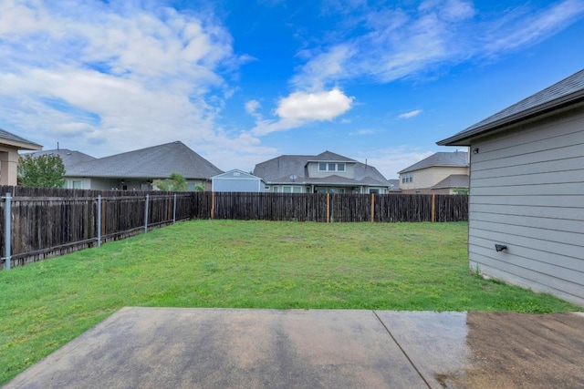view of yard with a patio area and a residential view