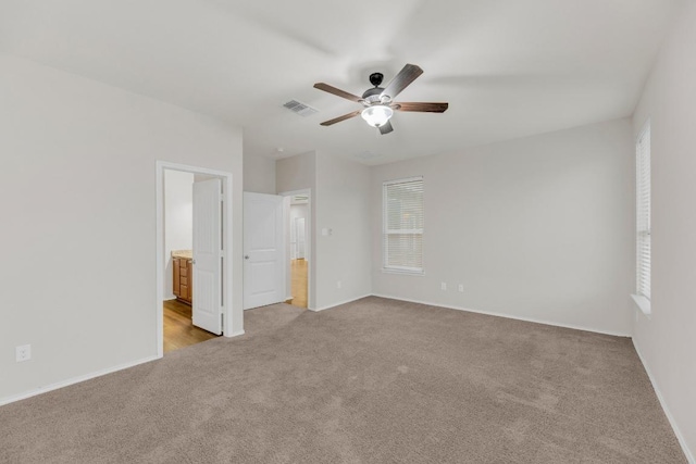 5928 Pescia St, Round Rock, TX 78665 - unfurnished bedroom featuring carpet, ensuite bathroom, and a ceiling fan