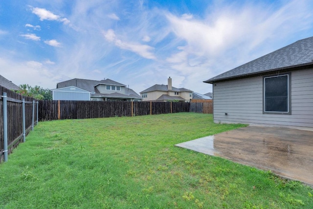 view of yard with a patio area and a residential view