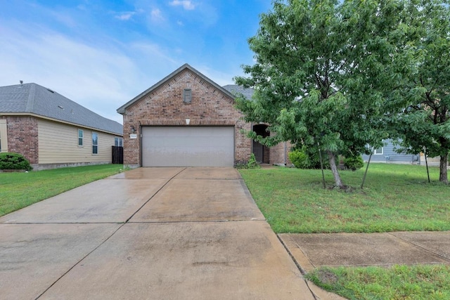 view of front of property with brick siding, a front yard, and concrete driveway