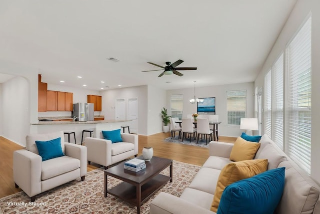 5928 Pescia St, Round Rock, TX 78665 - living area featuring light wood finished floors, a ceiling fan, and recessed lighting
