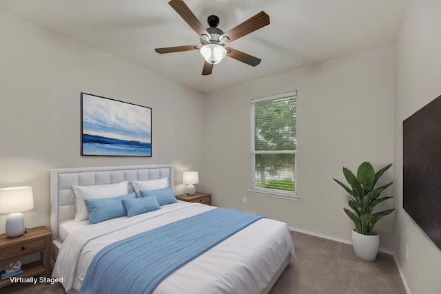 carpeted bedroom featuring baseboards and a ceiling fan