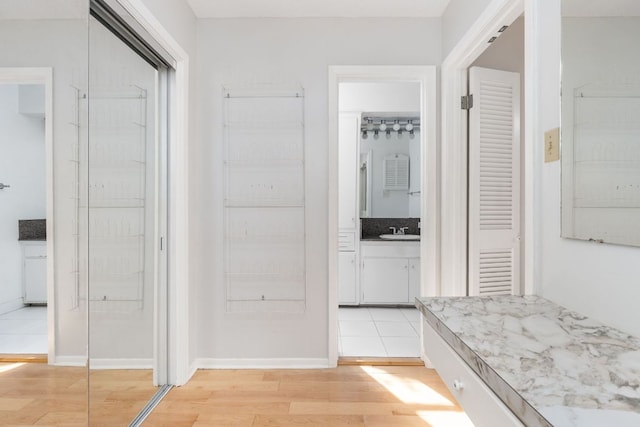 4007 Edgerock Dr, Austin, TX 78731 - bathroom with wood finished floors, vanity, and baseboards